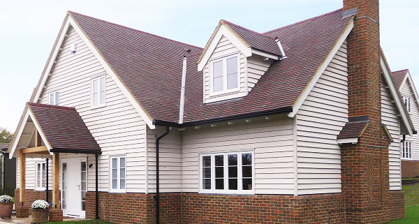 Black moulded ogee gutters on country homes