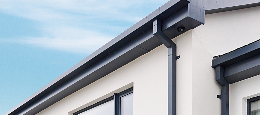 Black square aluminium downpipe and swan neck fitted to box guttering