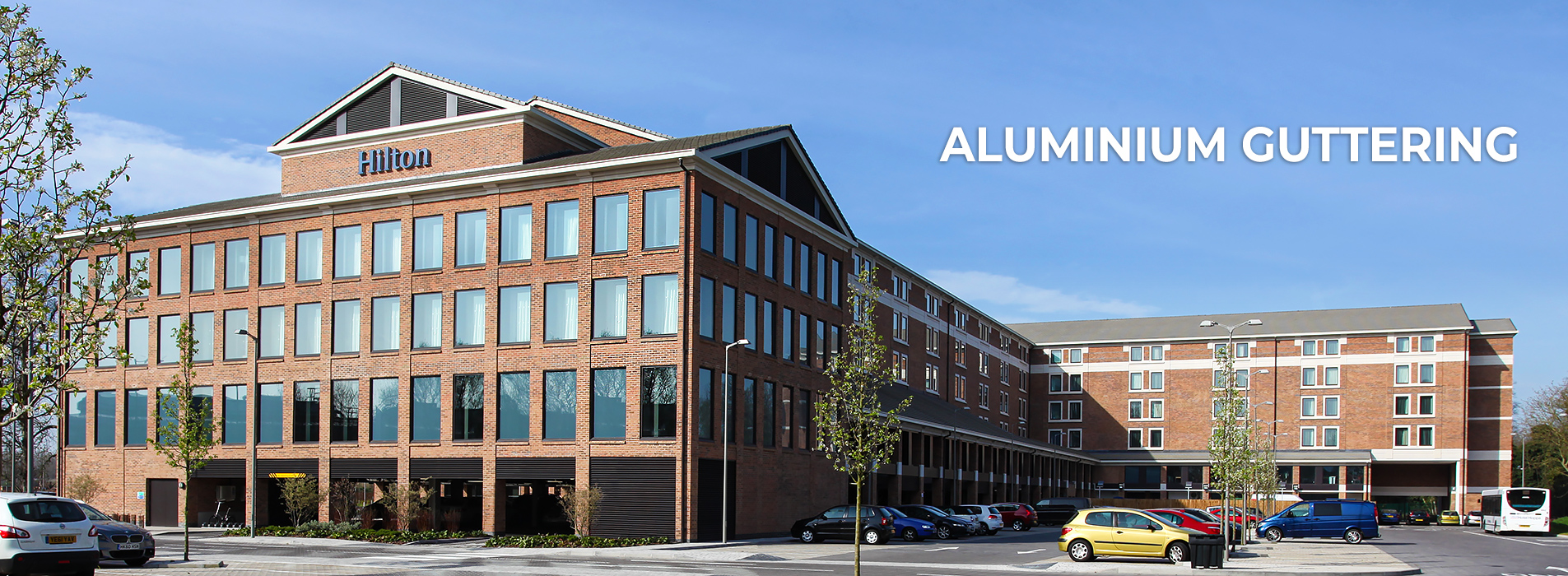 Aluminium box guttering, round downpipes, column and beams casings by Guttercrest for the Hilton Heathrow