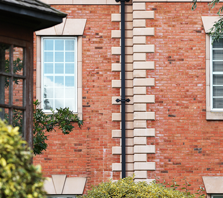 guttercrest aluminium fleur de lys cast downpipe brackets with georgian cast downpipes