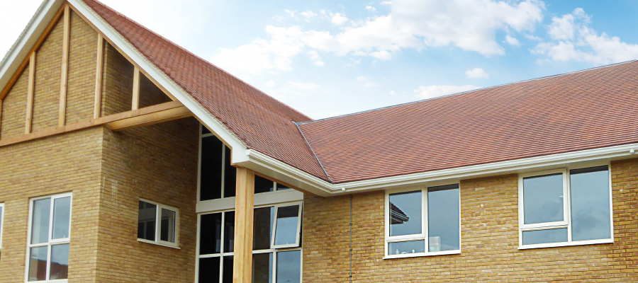 Aluminium primary trio, soffits, guttering and downpipes installed on care home