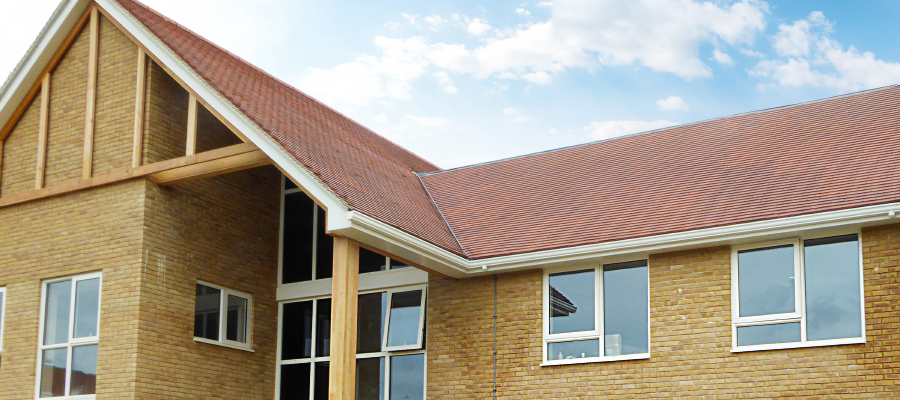 Aluminium primary trio, soffits, guttering and downpipes installed on care home