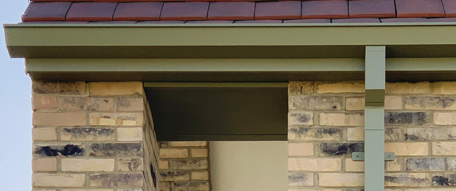 Aspire Guttering with Square Downpipe on Modern Brick Building | Guttercrest