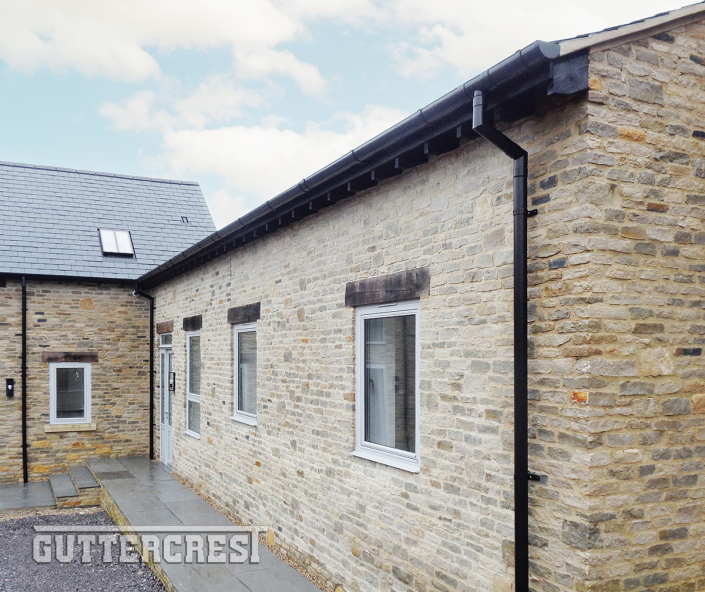 RAL9005 Matt Aluminium Beaded Deep Flow Gutter with Round Downpipe | Guttercrest RAL9005 matt black aluminium beaded deep flow gutter with round downpipe by Guttercrest